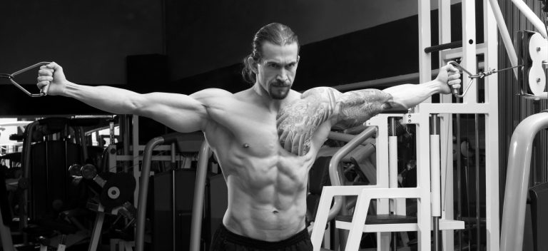 muscular man (20s) exercising in the gym